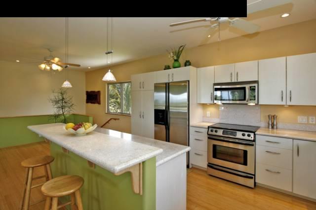 1355 Haiku Road Haiku, HI 96708 - Photo 8 of 30 a kitchen with a stove a sink and a refrigerator