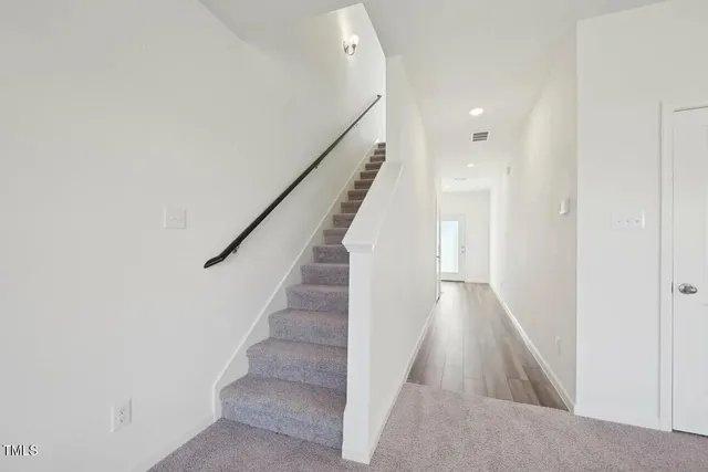 a view of a hallway with staircase