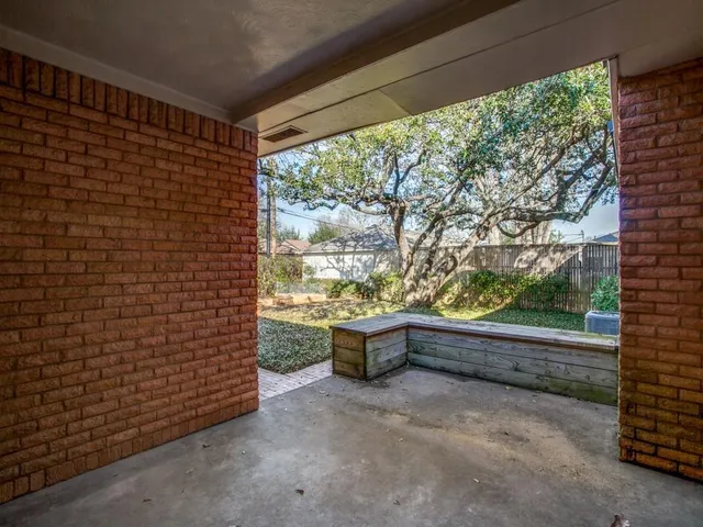 a view of backyard with tub and outdoor shower
