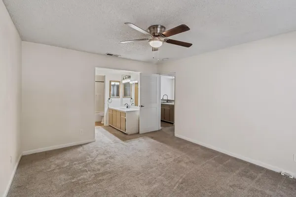 a bathroom with a sink a light fixture and a mirror