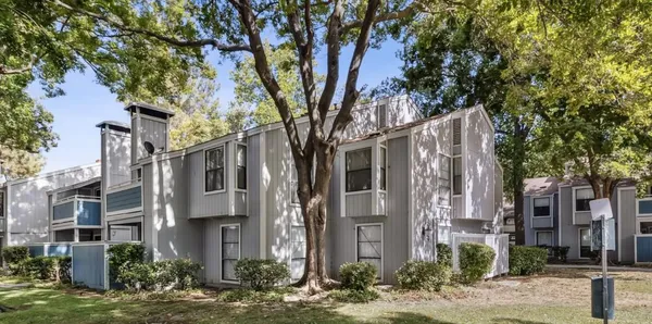 a view of a building with a tree