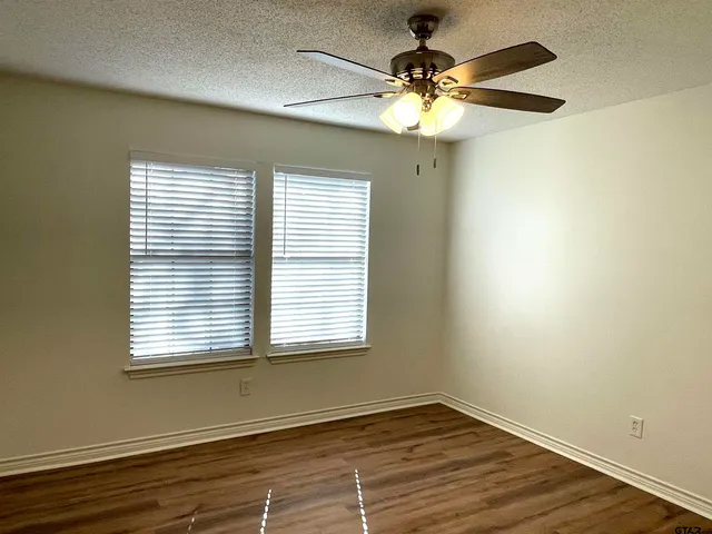 a bathroom with a toilet and a bathtub