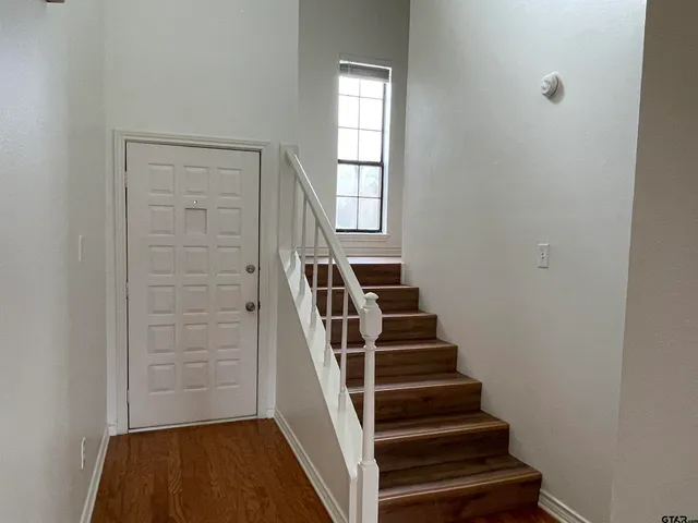 a view of entryway with wooden floor