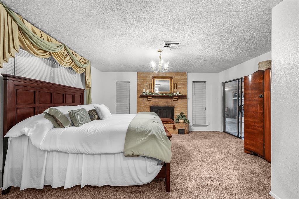 748 Rocky Ridge Lane Weatherford, TX 76085 - Photo 9 of 38 a bed room with a bed and a television