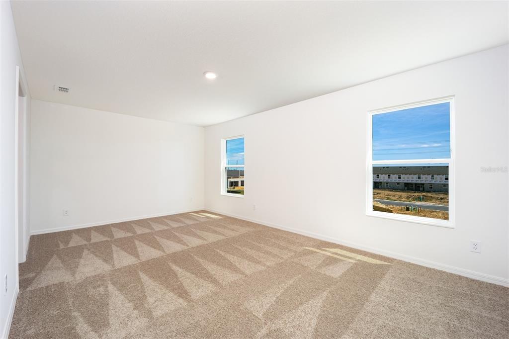 696 Poppy Lane Dundee, FL 33838 - Photo 9 of 16 a view of an empty room with a window