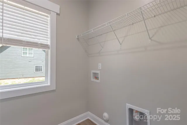 a bathroom with a window and a shower