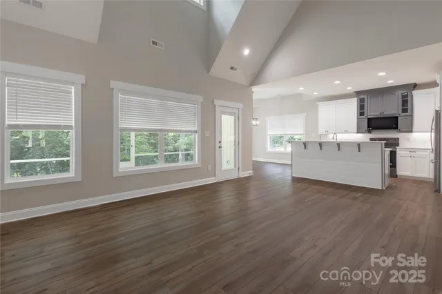 a view of kitchen with cabinets and wooden floor