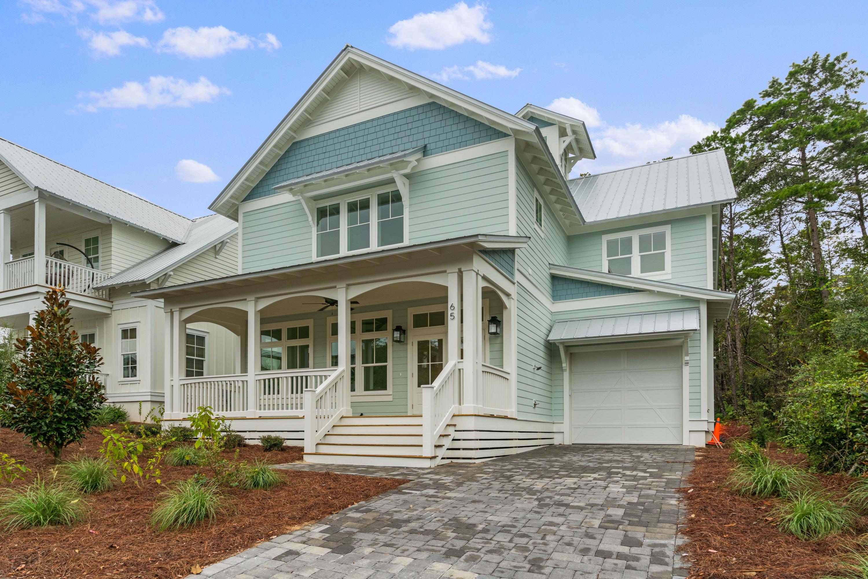 69 Matts Way Way Santa Rosa Beach, FL 32459 - Photo 1 of 37 a front view of a house with a yard