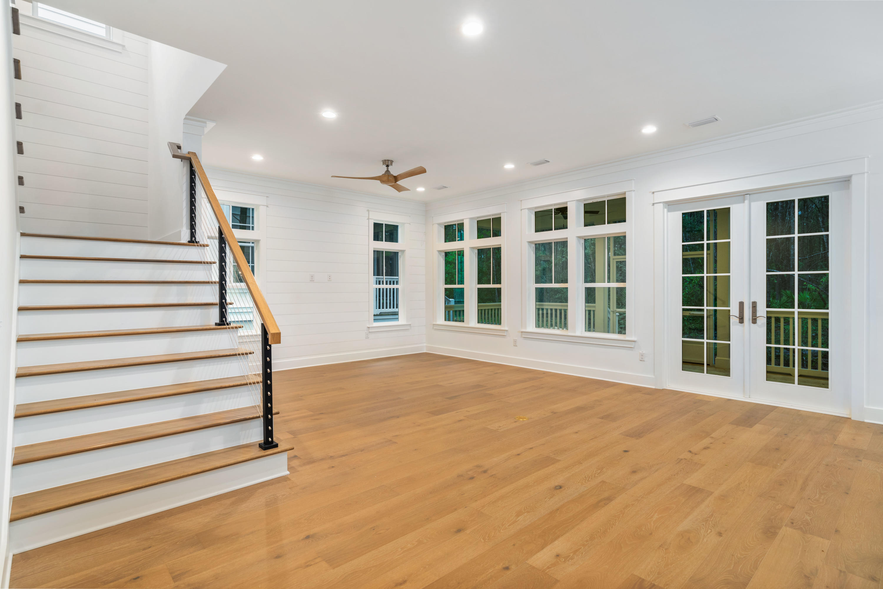 69 Matts Way Way Santa Rosa Beach, FL 32459 - Photo 12 of 37 a view of an empty room with a window and stairs