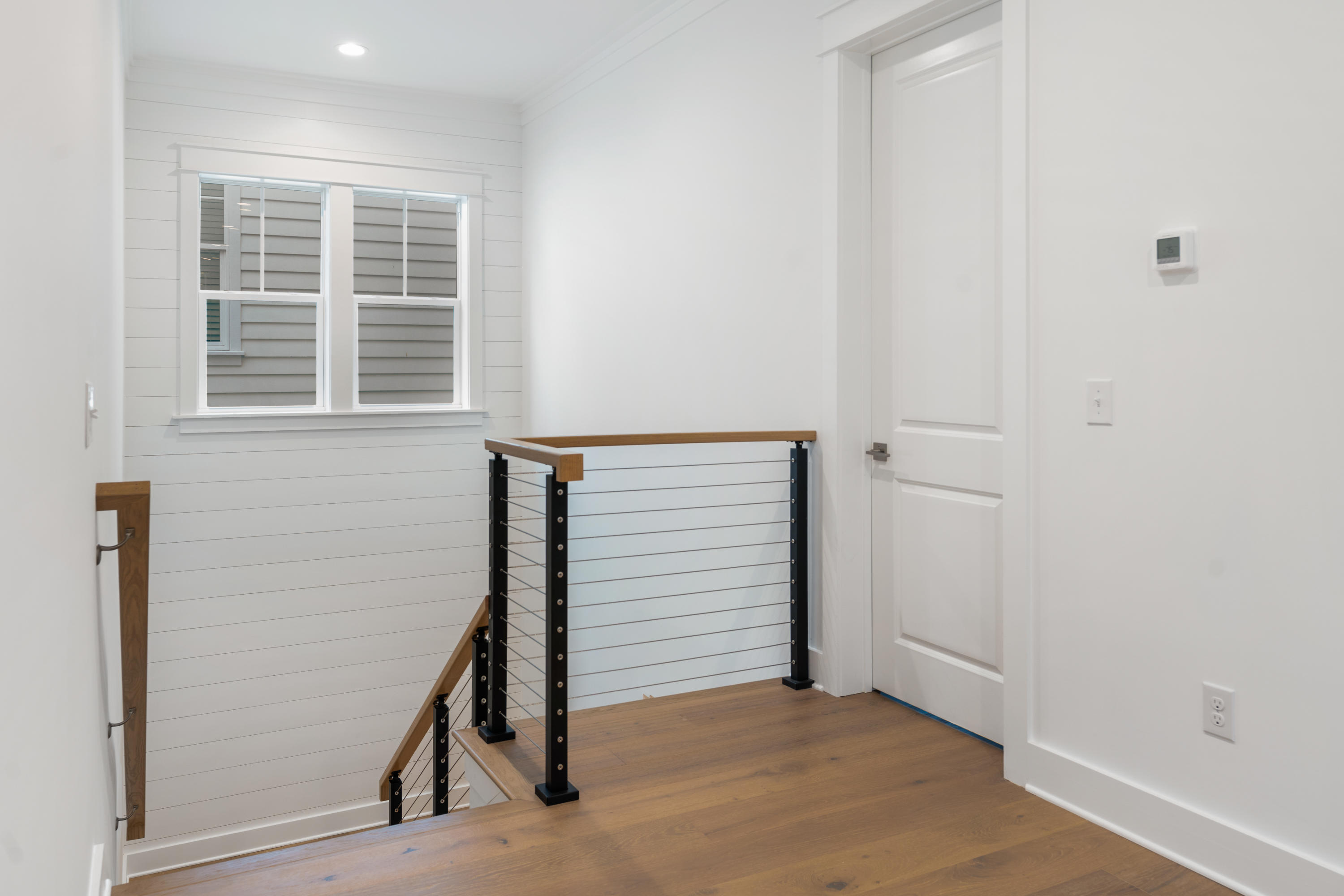 69 Matts Way Way Santa Rosa Beach, FL 32459 - Photo 20 of 37 an entryway with wooden floor and windows