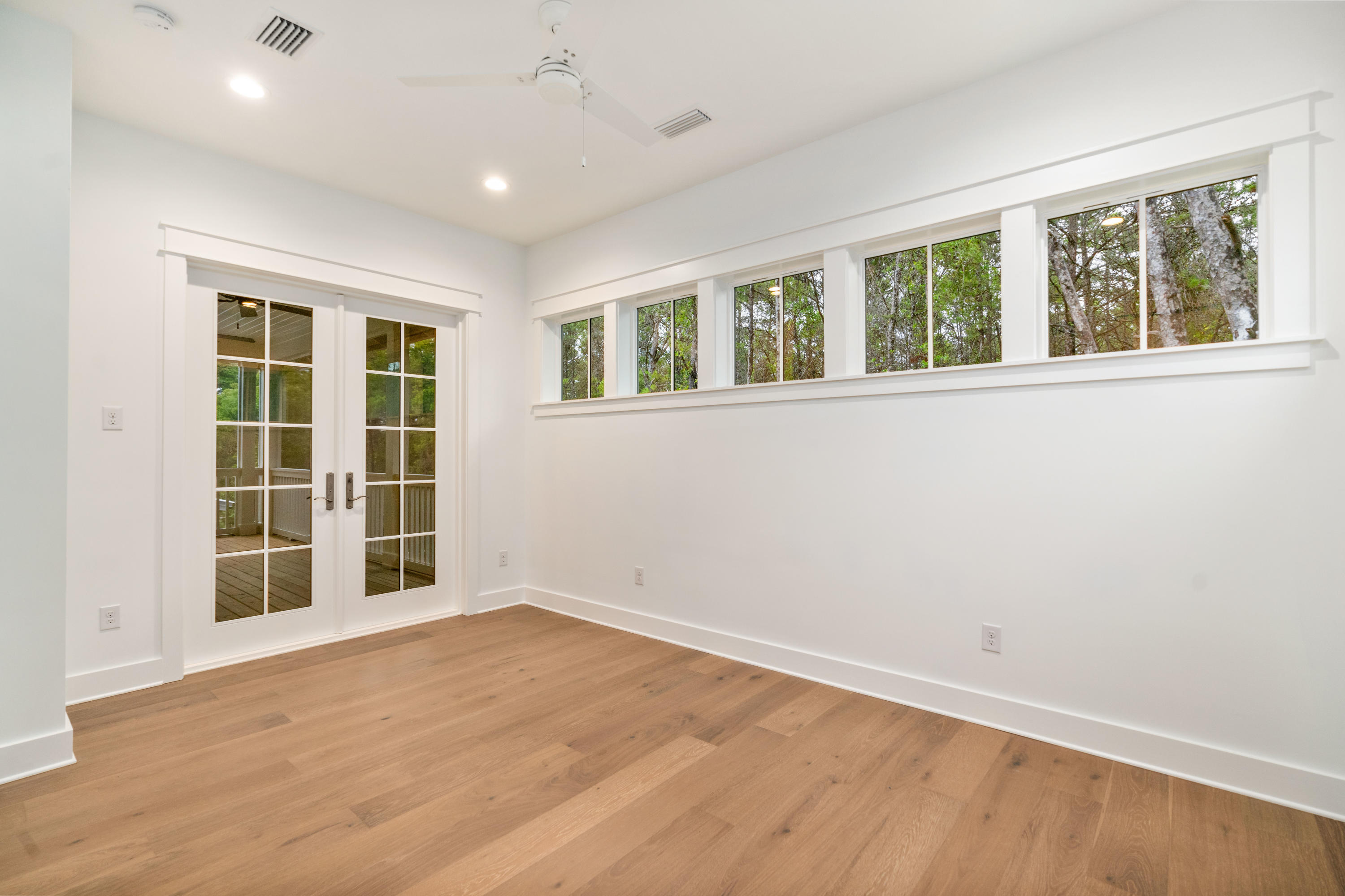 69 Matts Way Way Santa Rosa Beach, FL 32459 - Photo 24 of 37 an empty room with wooden floor and windows