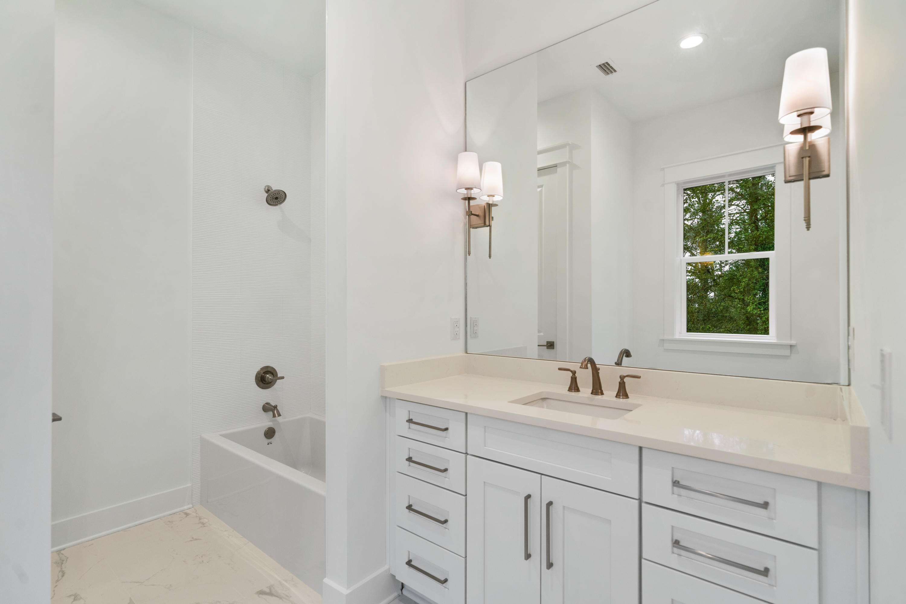 69 Matts Way Way Santa Rosa Beach, FL 32459 - Photo 26 of 37 a bathroom with a tub sink and mirror