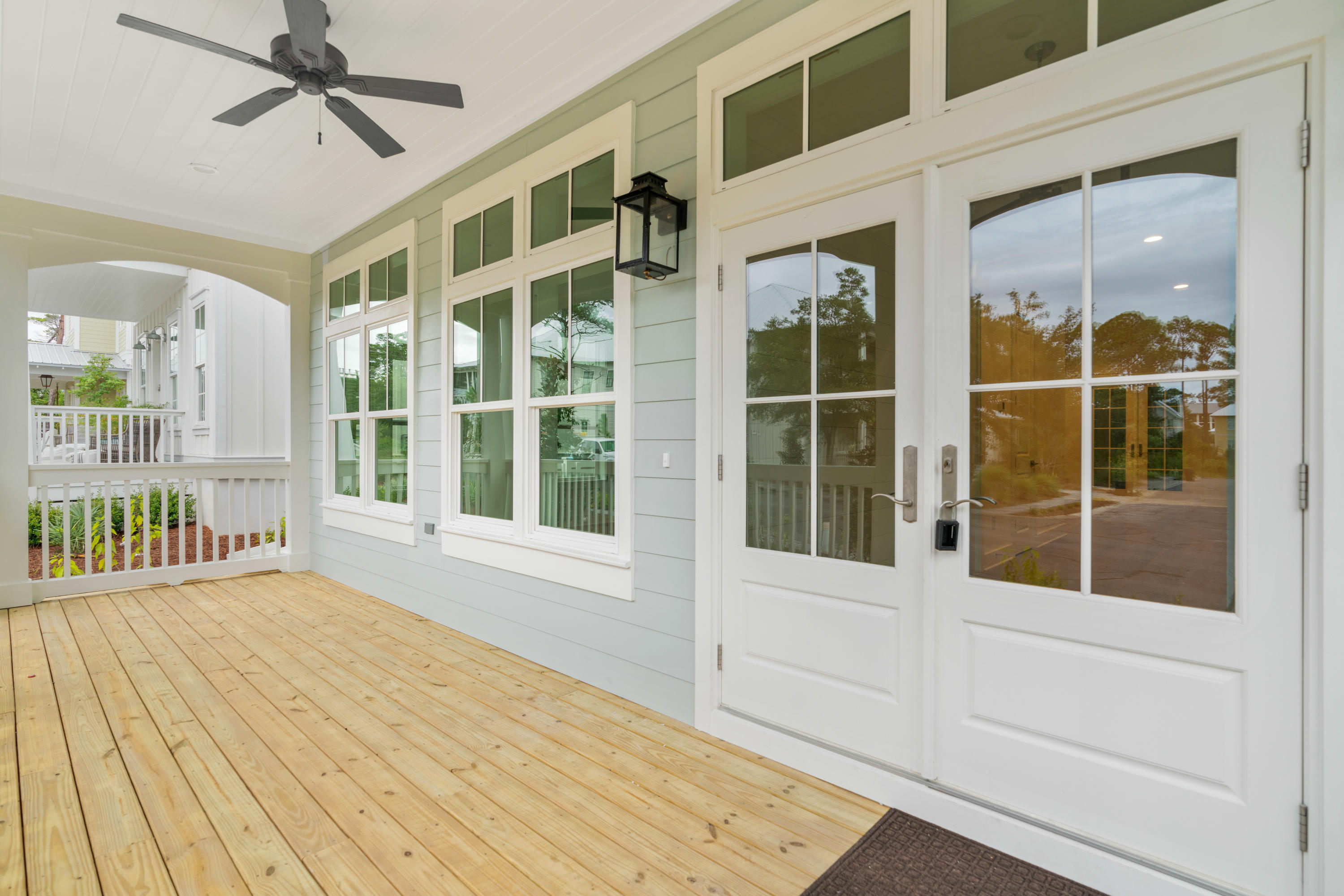 69 Matts Way Way Santa Rosa Beach, FL 32459 - Photo 4 of 37 a view of a balcony with wooden floor and windows