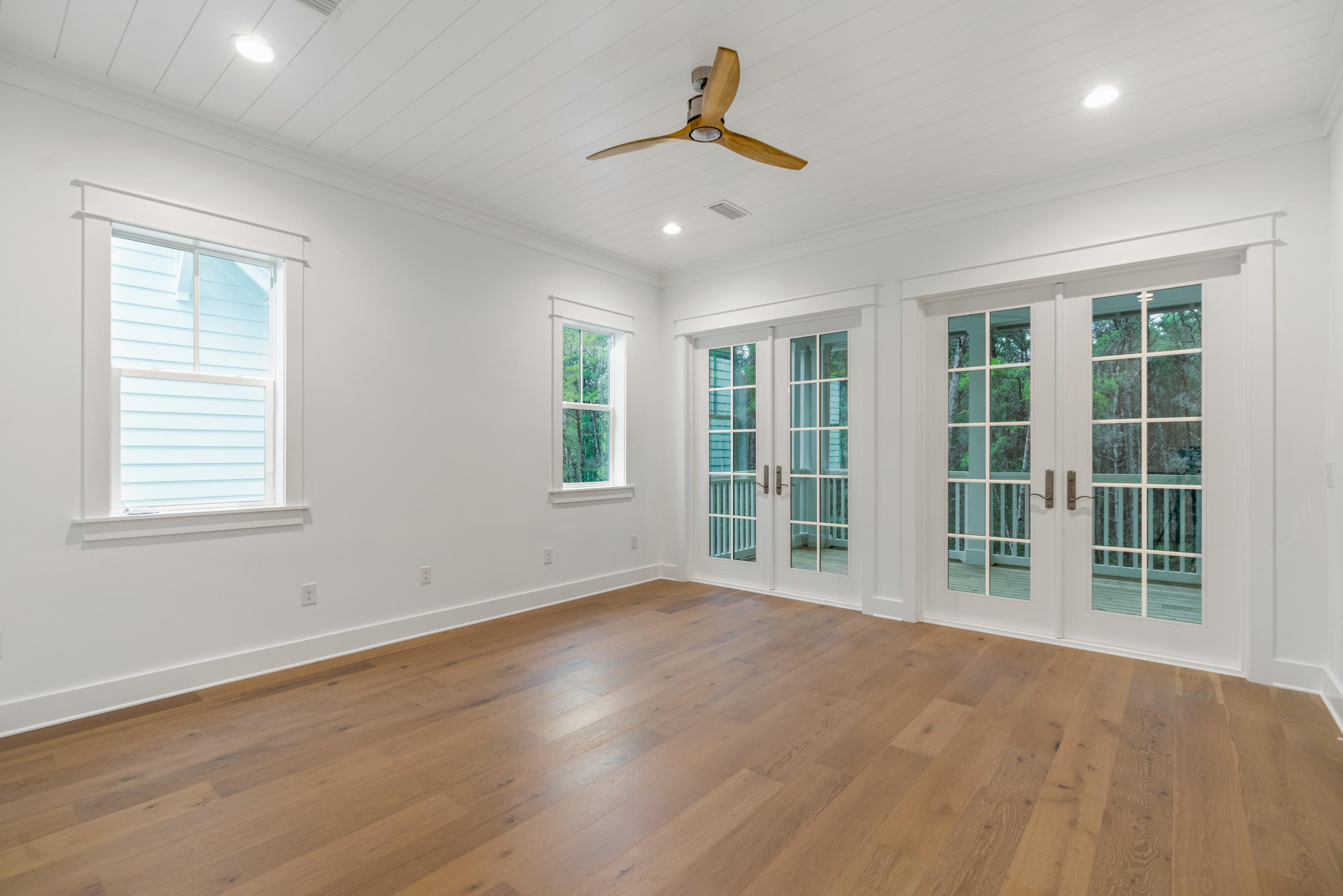 69 Matts Way Way Santa Rosa Beach, FL 32459 - Photo 32 of 37 a view of an empty room with a window and wooden floor