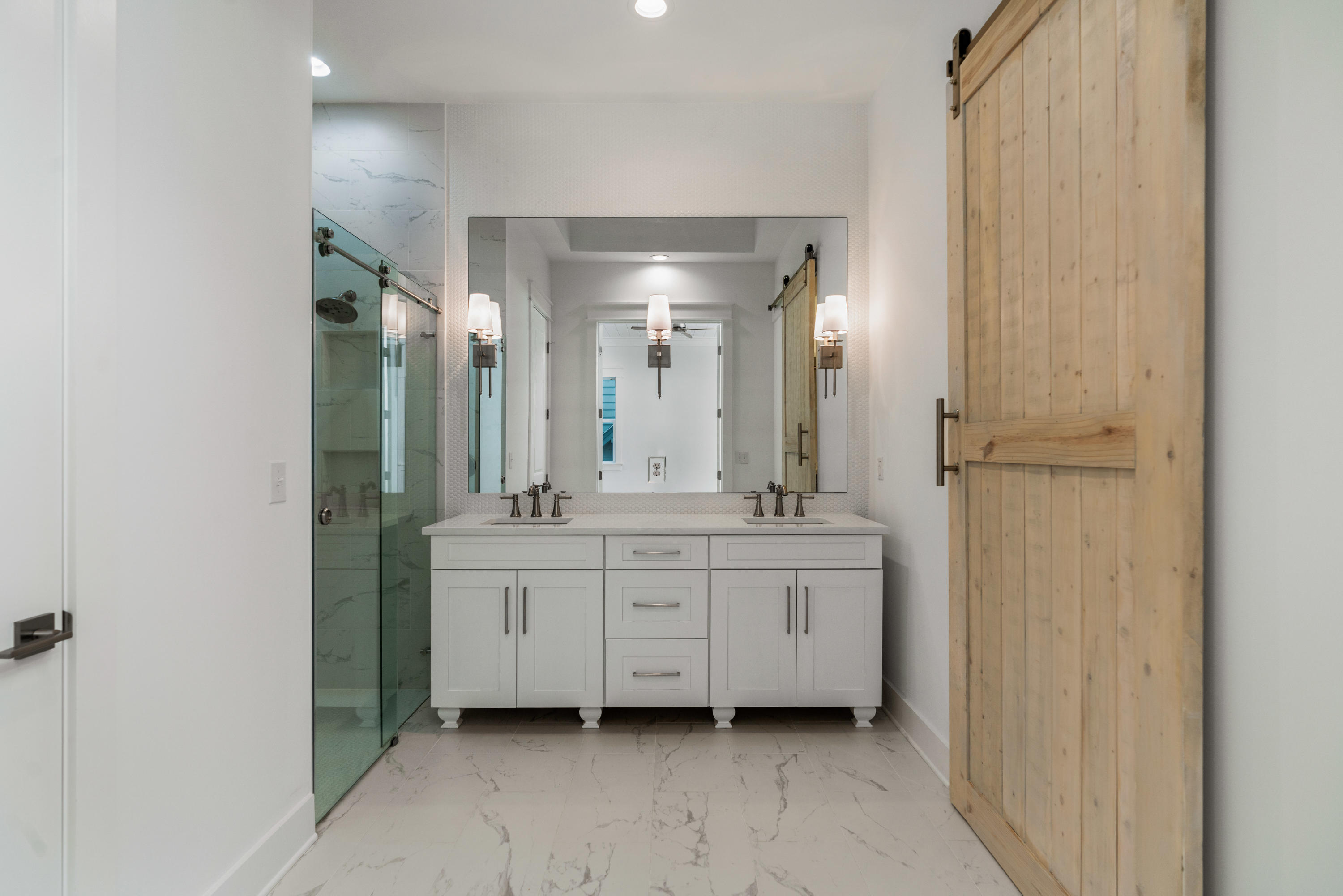 69 Matts Way Way Santa Rosa Beach, FL 32459 - Photo 35 of 37 a spacious bathroom with a double vanity sink and a mirror