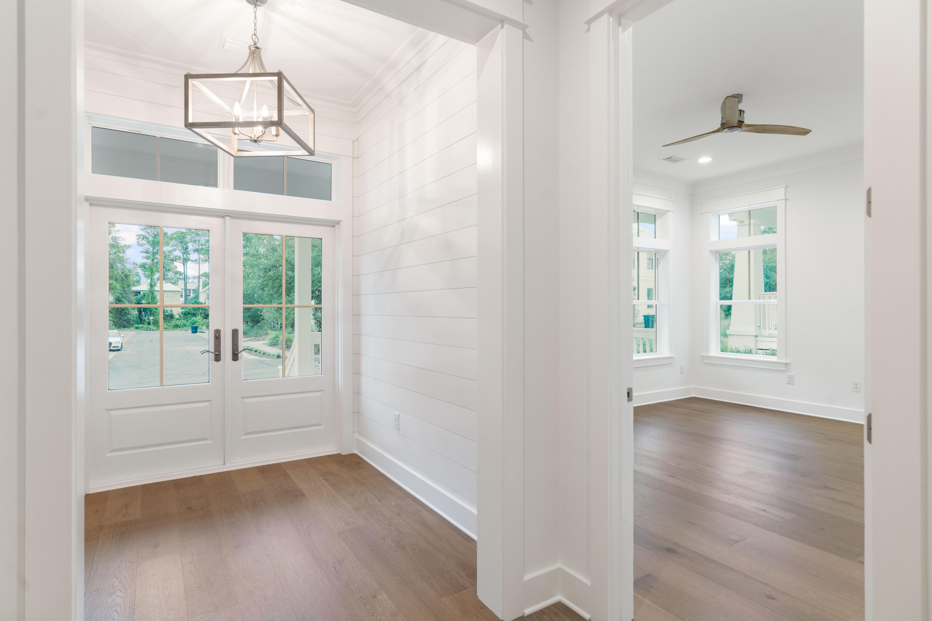 69 Matts Way Way Santa Rosa Beach, FL 32459 - Photo 5 of 37 a view of an empty room with wooden floor and a window