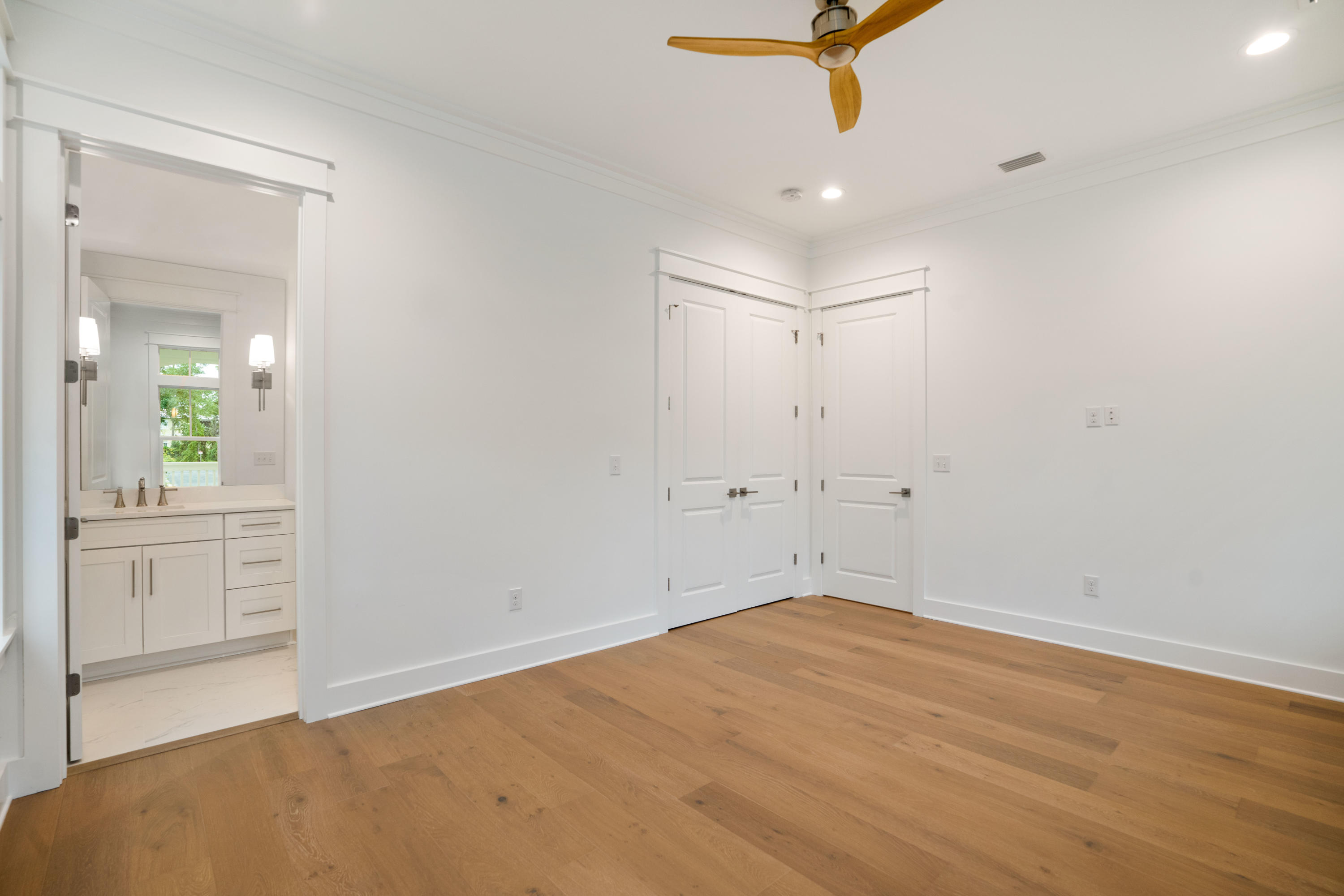 69 Matts Way Way Santa Rosa Beach, FL 32459 - Photo 8 of 37 wooden floor in an empty room with a window