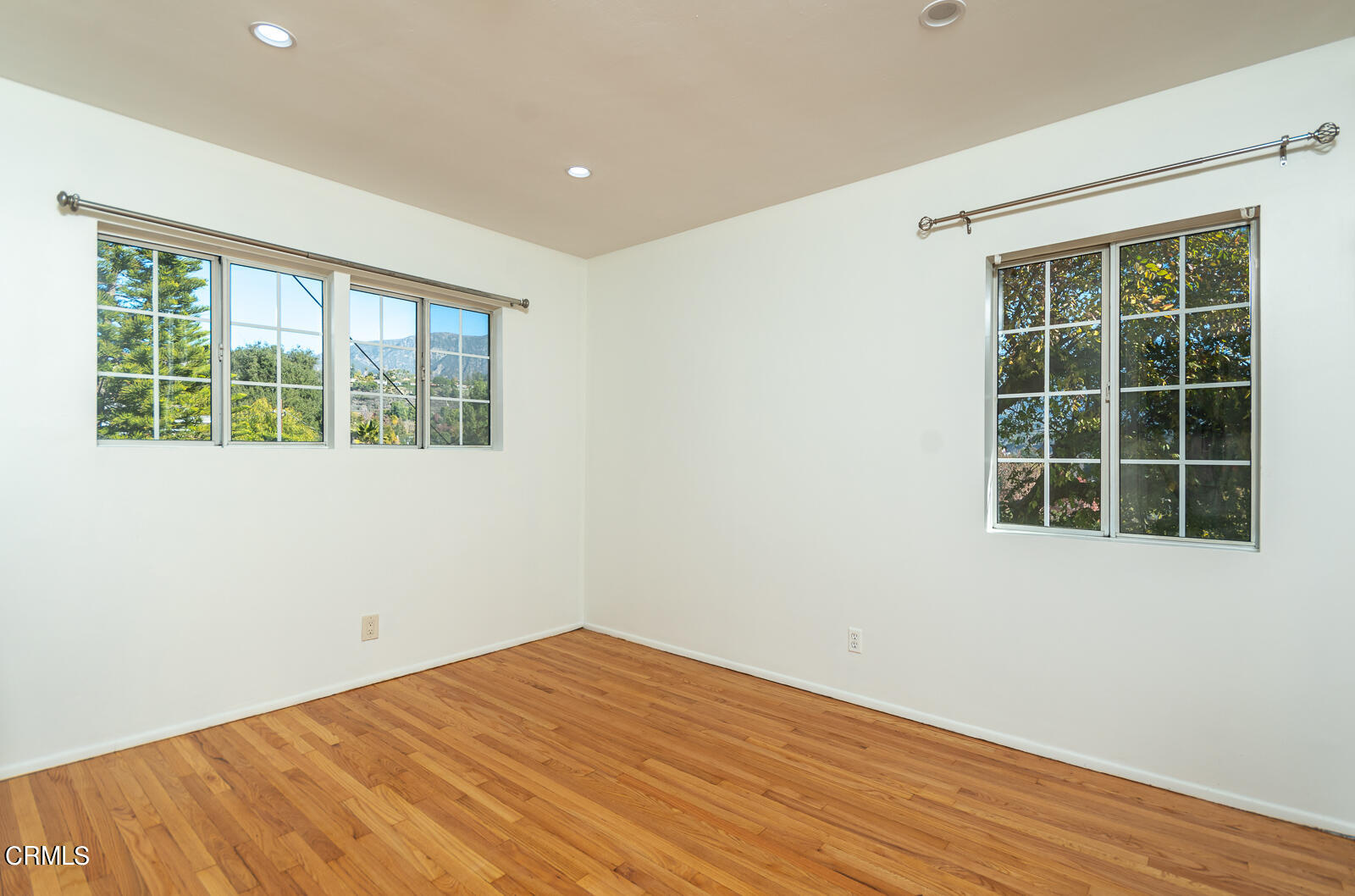 4516 Daleridge Road La Canada Flintridge, CA 91011 - Photo 12 of 22 a view of empty room with wooden floor and windows
