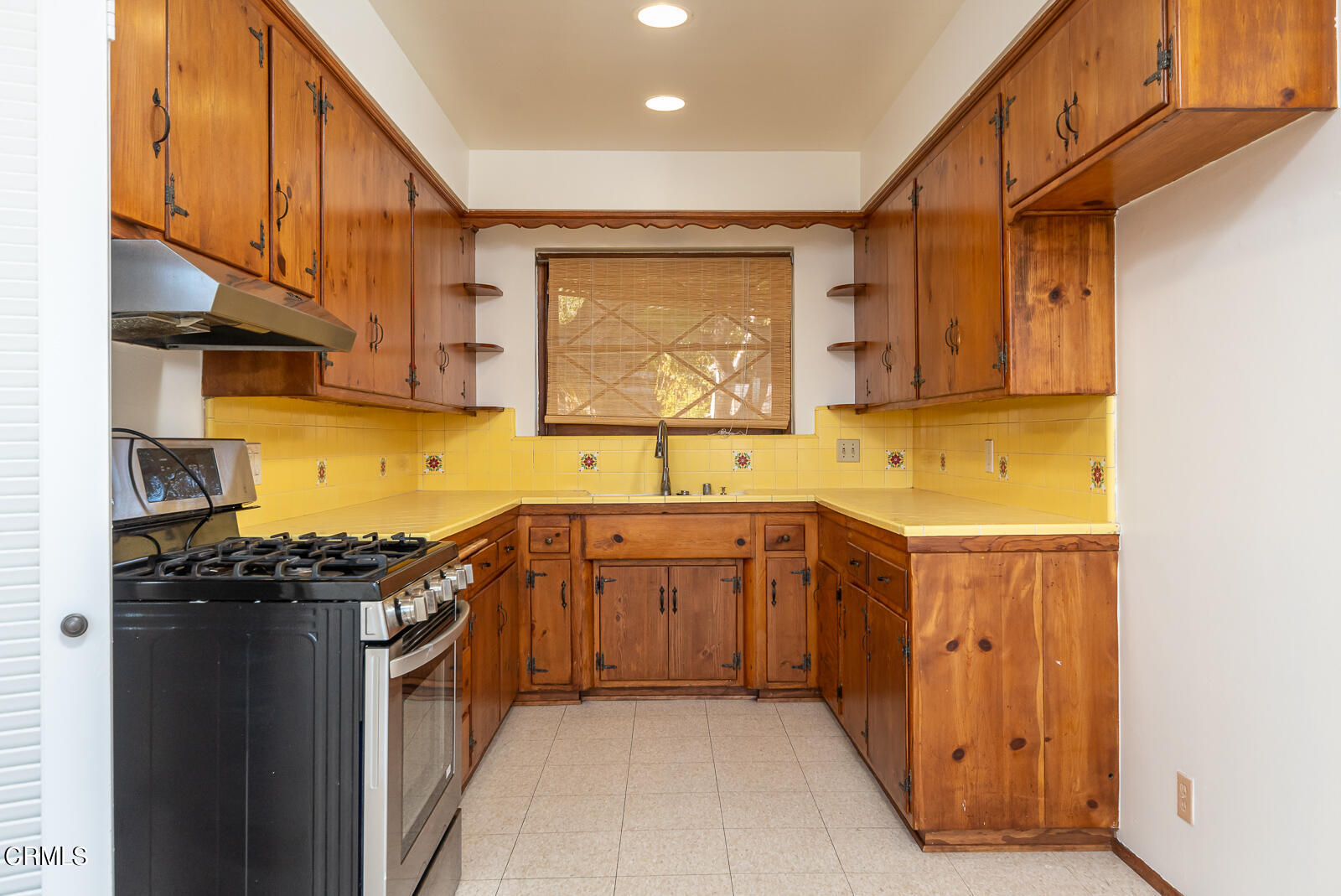 4516 Daleridge Road La Canada Flintridge, CA 91011 - Photo 6 of 22 a kitchen with stainless steel appliances granite countertop a sink a stove and a refrigerator