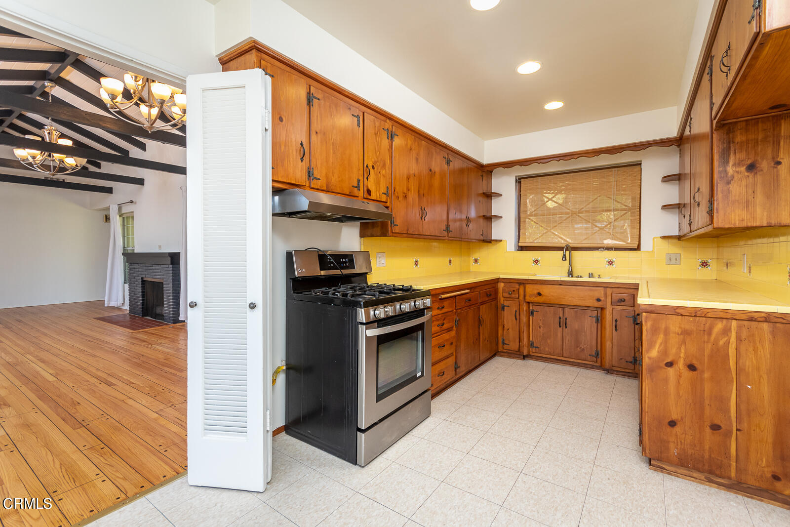 4516 Daleridge Road La Canada Flintridge, CA 91011 - Photo 7 of 22 a kitchen with stainless steel appliances granite countertop a stove sink and cabinets