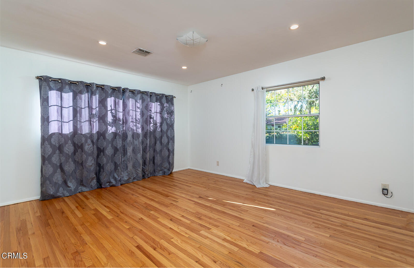 4516 Daleridge Road La Canada Flintridge, CA 91011 - Photo 10 of 22 a view of empty room with wooden floor and fan