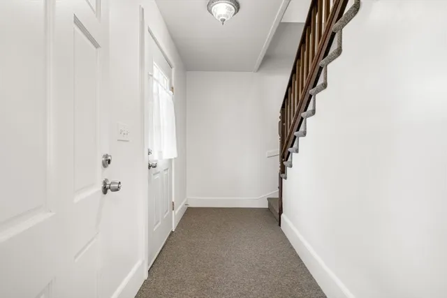 a kitchen with a sink stove top oven and cabinets