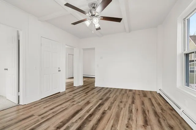 an empty room with a empty space and windows