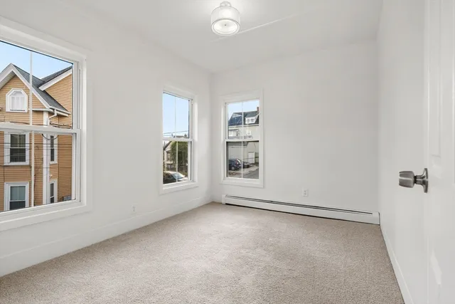 a kitchen with furniture a stove a sink and a refrigerator
