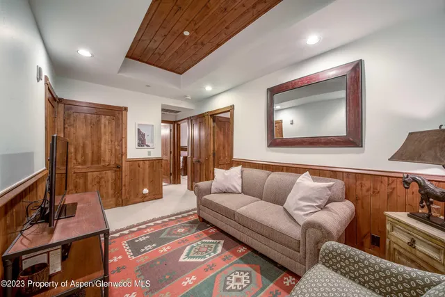 a bathroom with a double vanity sink and mirror with shower