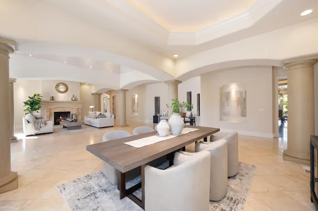 a kitchen with stainless steel appliances granite countertop a stove a sink and a granite island