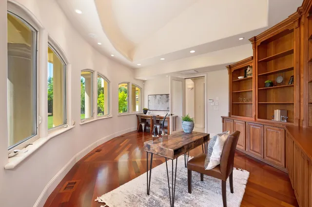 a view of kitchen and dining room with wooden floor