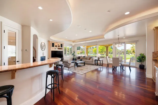 a view of an entryway with wooden floor
