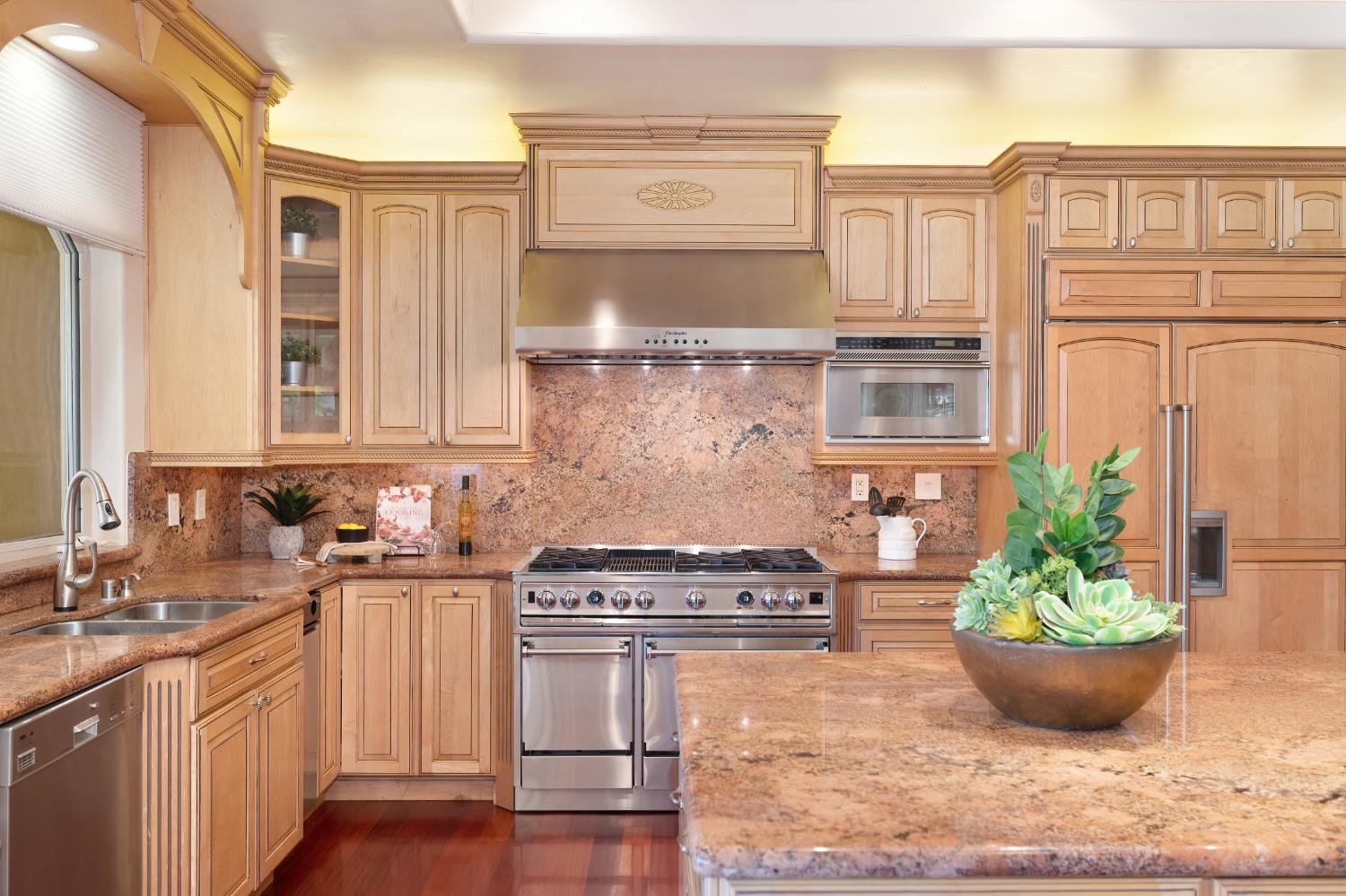 5037 Milton Ranch Road Shingle Springs, CA 95682 - Photo 28 of 99 a kitchen with stainless steel appliances granite countertop a stove a sink and a granite island