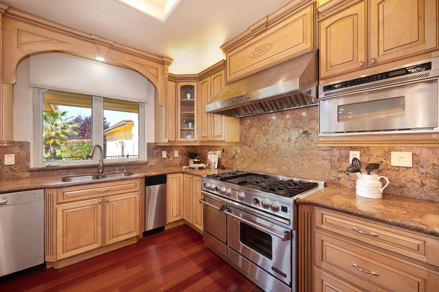5037 Milton Ranch Road Shingle Springs, CA 95682 - Photo 34 of 99 a kitchen with stainless steel appliances granite countertop a stove and a sink