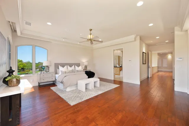 a kitchen with granite countertop white cabinets and sink