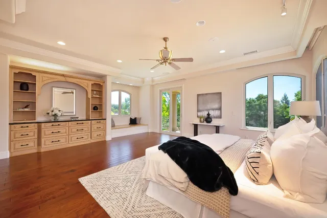 a view of a swimming pool with a yard