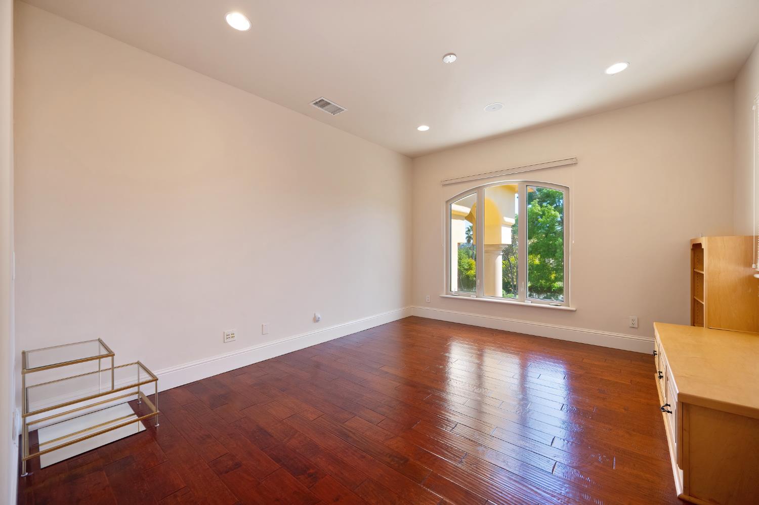 5037 Milton Ranch Road Shingle Springs, CA 95682 - Photo 47 of 99 an empty room with wooden floor and windows