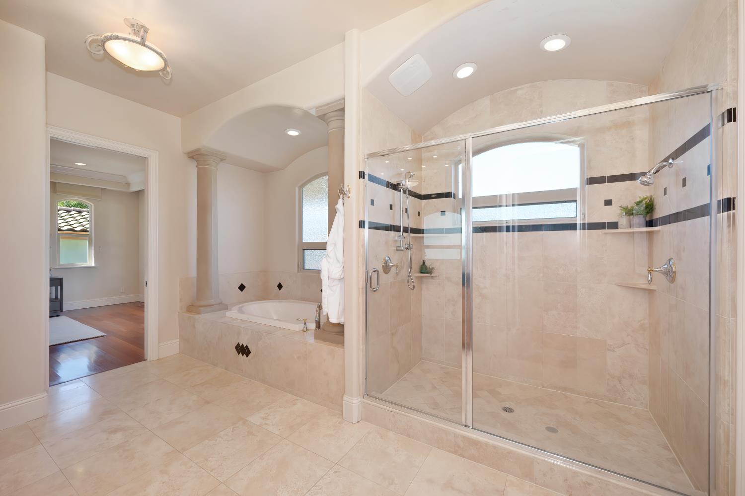 5037 Milton Ranch Road Shingle Springs, CA 95682 - Photo 72 of 99 a bathroom with a glass shower door and a sink