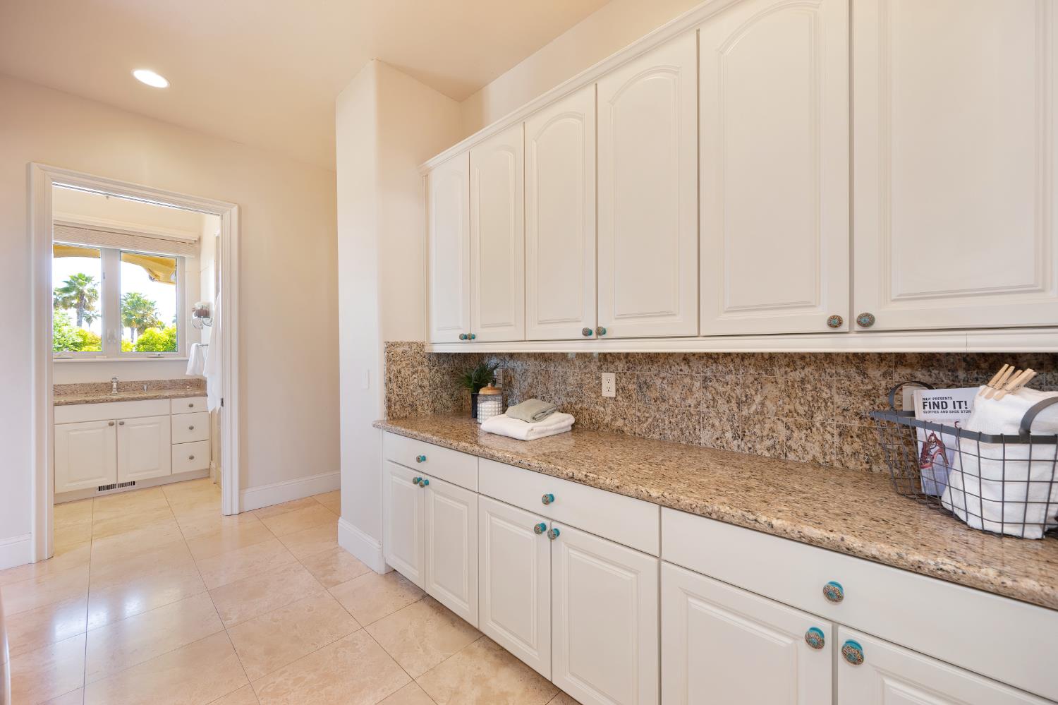 5037 Milton Ranch Road Shingle Springs, CA 95682 - Photo 77 of 99 a kitchen with granite countertop white cabinets and sink