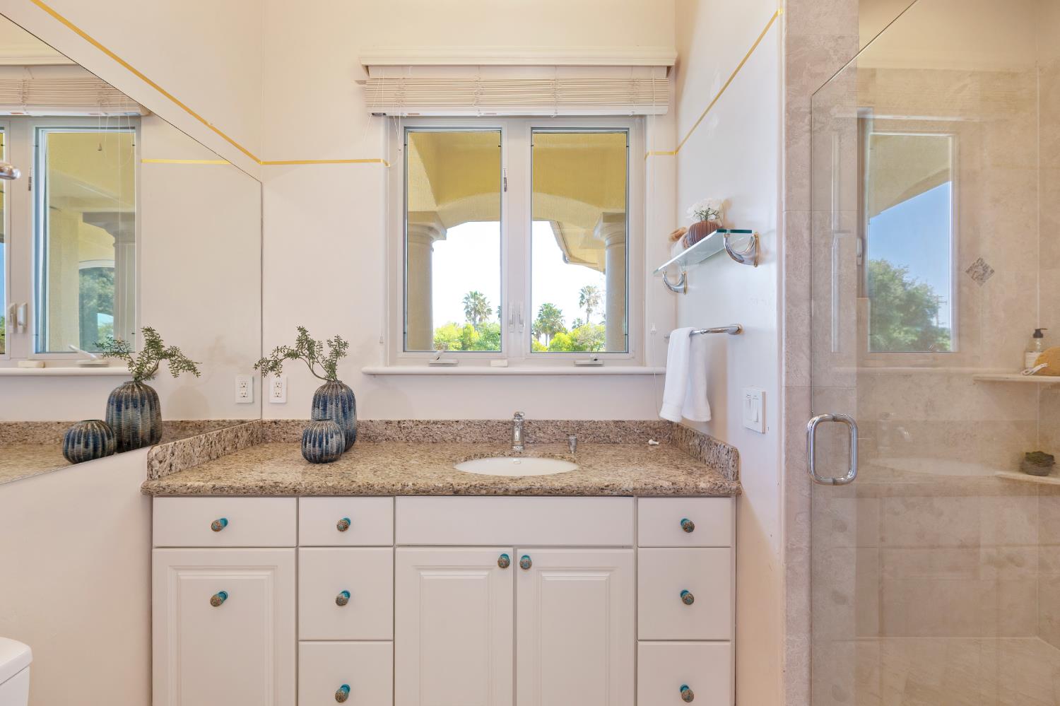 5037 Milton Ranch Road Shingle Springs, CA 95682 - Photo 78 of 99 a bathroom with a granite countertop sink and a mirror