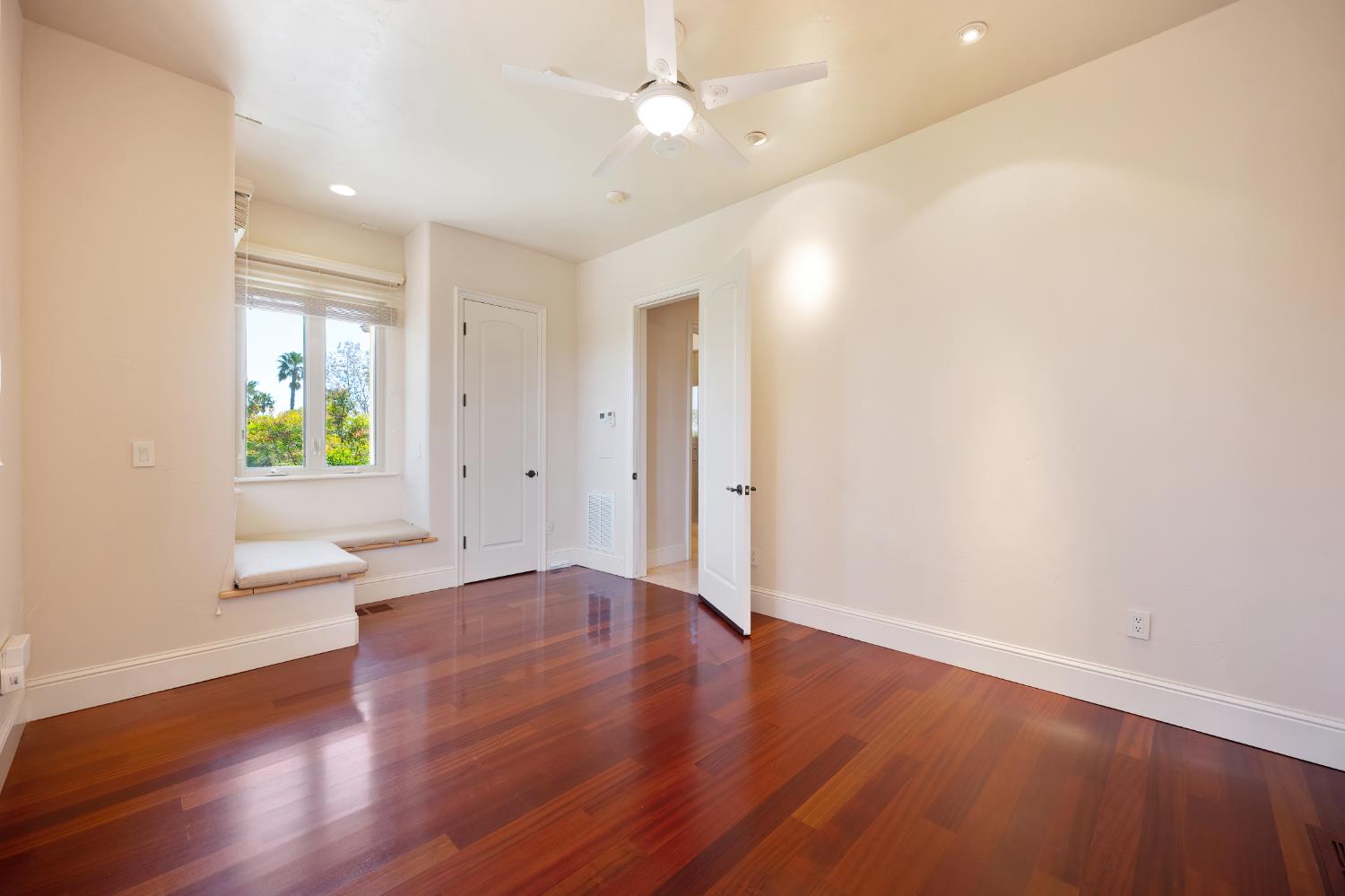 5037 Milton Ranch Road Shingle Springs, CA 95682 - Photo 79 of 99 an empty room with wooden floor and windows