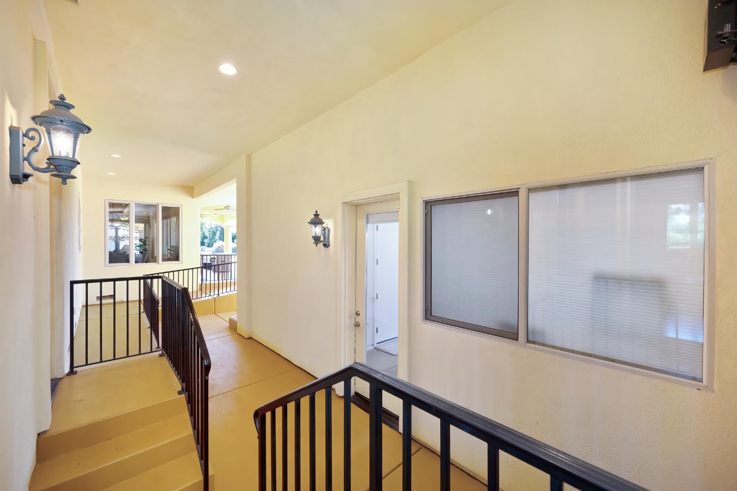 5037 Milton Ranch Road Shingle Springs, CA 95682 - Photo 81 of 99 a view of a hallway with wooden floor and staircase