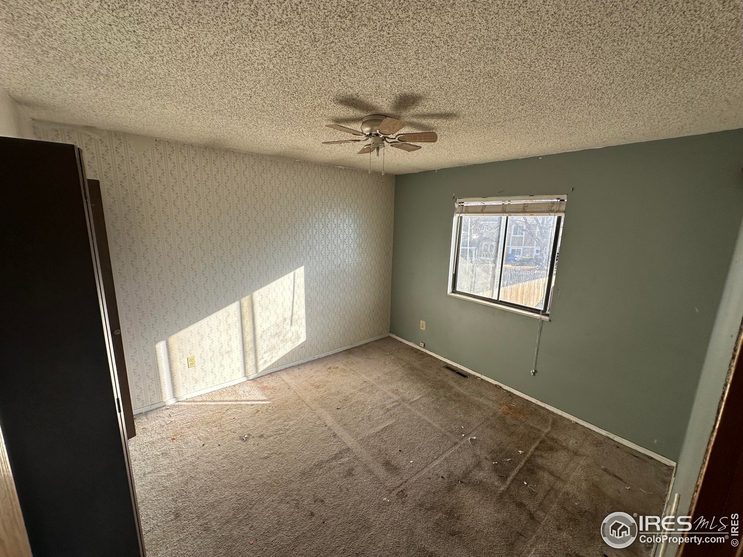 832 21st Street Southwest Loveland, CO 80537 - Photo 12 of 15 a view of an empty room with a window