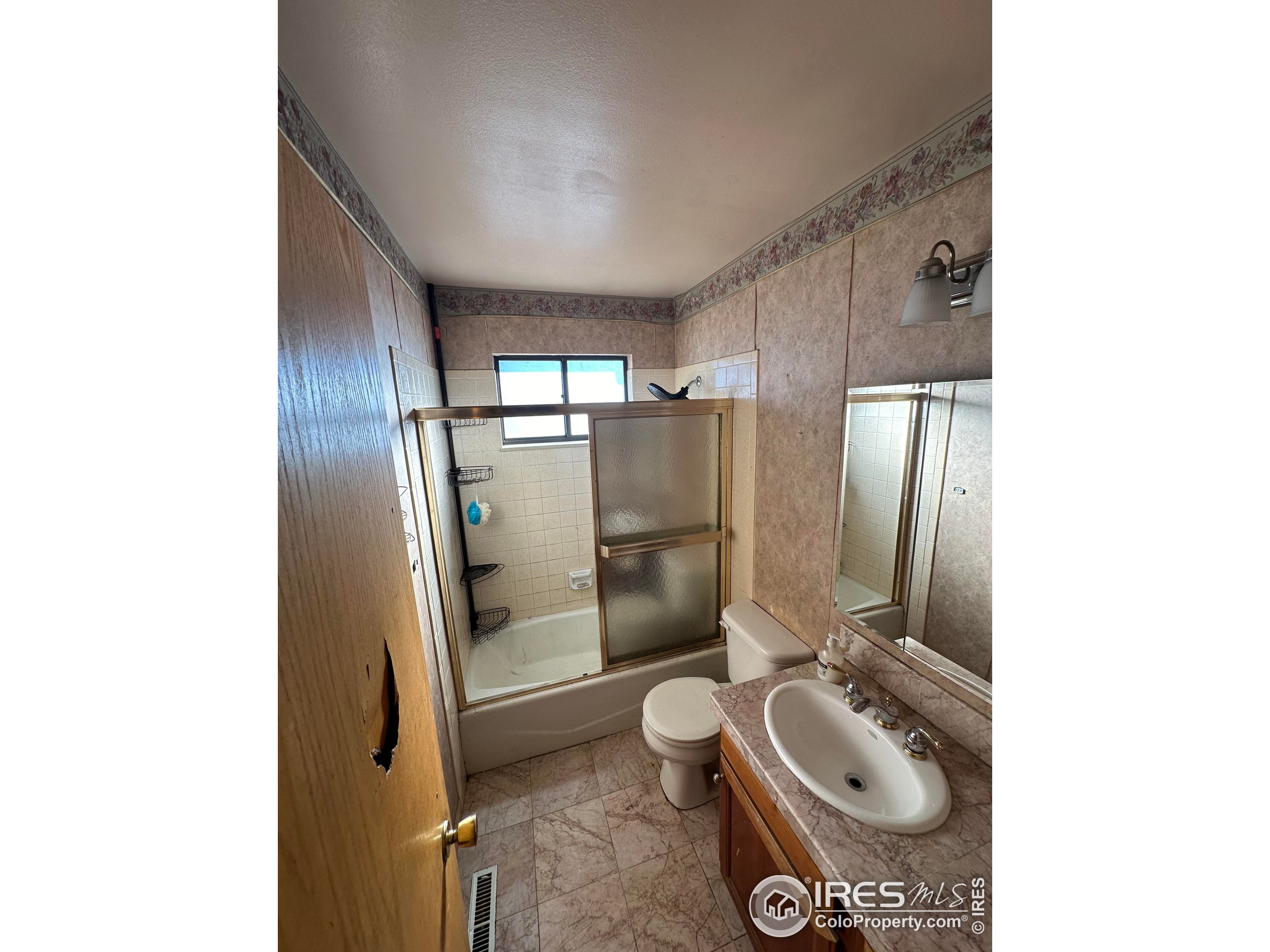 832 21st Street Southwest Loveland, CO 80537 - Photo 14 of 15 a bathroom with a sink toilet and shower