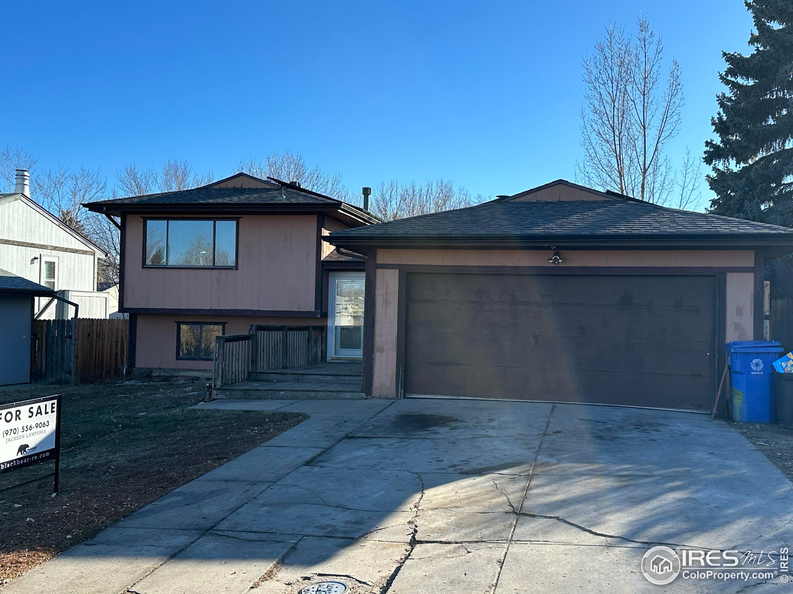 832 21st Street Southwest Loveland, CO 80537 - Photo 2 of 15 a view of a house with wooden fence