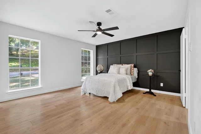 a bedroom with a bed and window