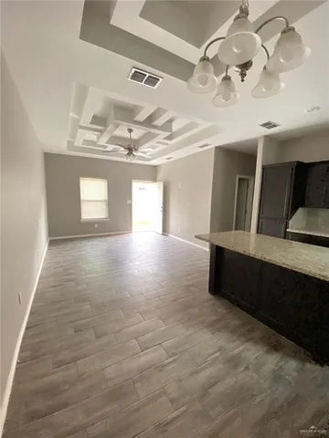 a view of entryway and kitchen