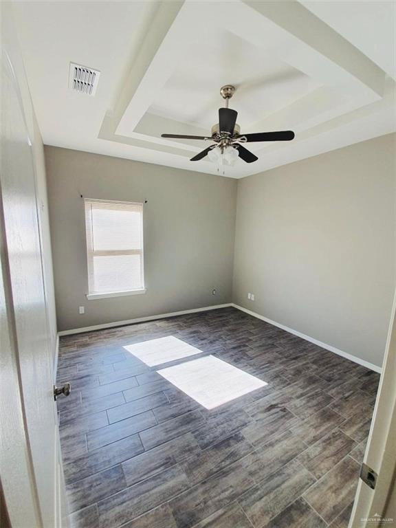 2000 Jackson Street, Unit 1 Weslaco, TX 78599 - Photo 7 of 10 an empty room with wooden floor and windows
