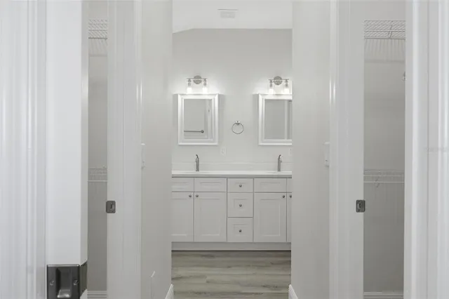 a bathroom with a sink and vanity