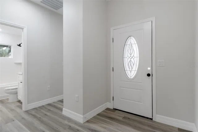 a view of entryway with wooden floor